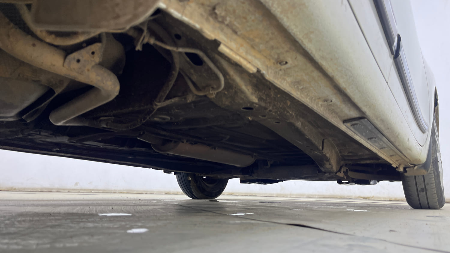 Used 2020 Maruti Suzuki Dzire VXi Petrol Manual extra REAR RIGHT UNDERBODY VIEW