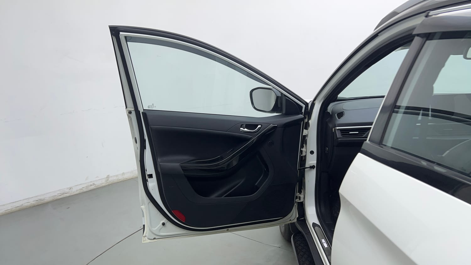 Used 2024 tata Nexon Fearless S 1.2 Revotron Petrol 7DCA Dual Tone Petrol Automatic interior LEFT FRONT DOOR OPEN VIEW