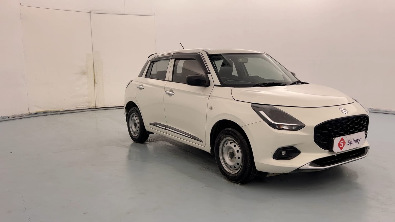Used 2025 Maruti Suzuki Swift LXi Petrol Manual exterior RIGHT FRONT CORNER VIEW