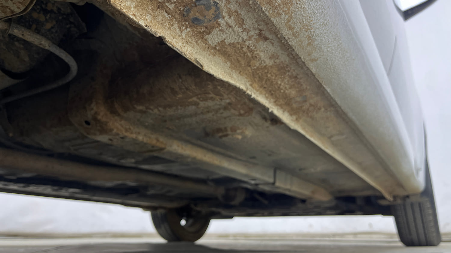 Used 2024 Hyundai Aura SX 1.2 (O) Petrol Petrol Manual extra REAR RIGHT UNDERBODY VIEW