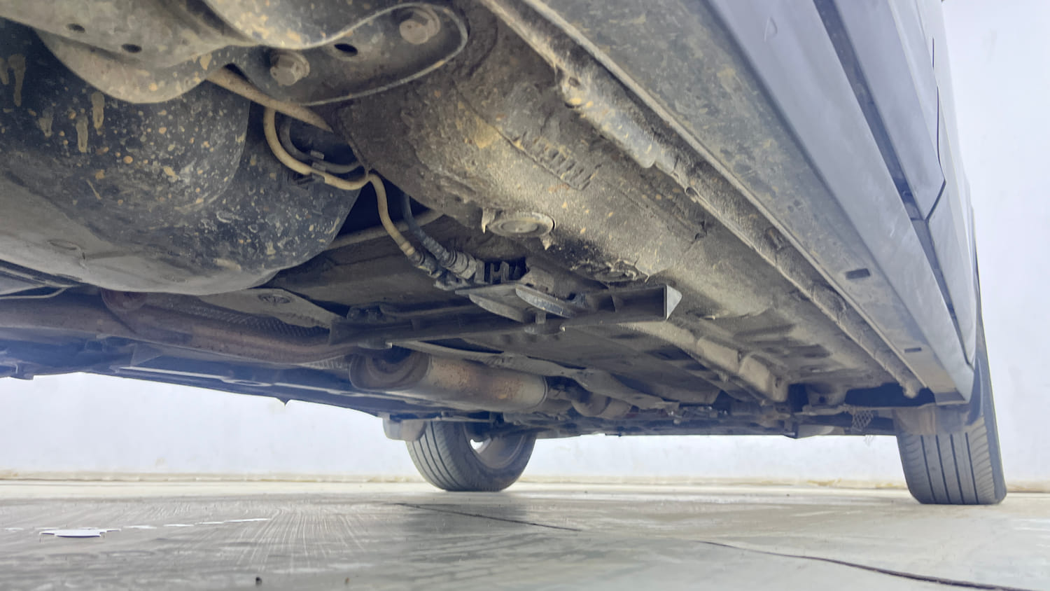 Used 2023 Volkswagen Taigun Topline 1.0 TSI MT Petrol Manual extra REAR RIGHT UNDERBODY VIEW