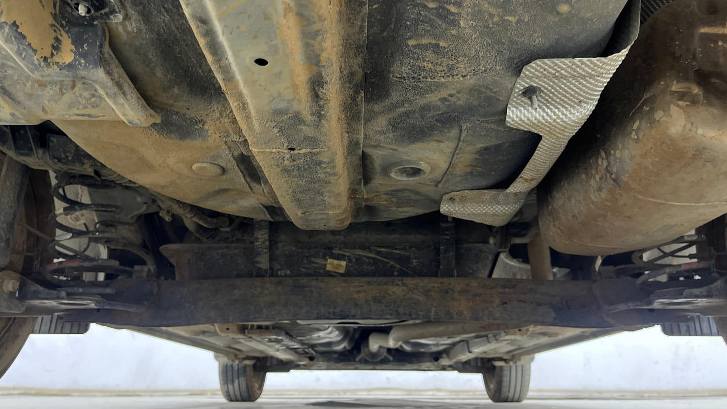 Used 2024 Hyundai Aura SX 1.2 (O) Petrol Petrol Manual extra REAR UNDERBODY VIEW (TAKEN FROM REAR)