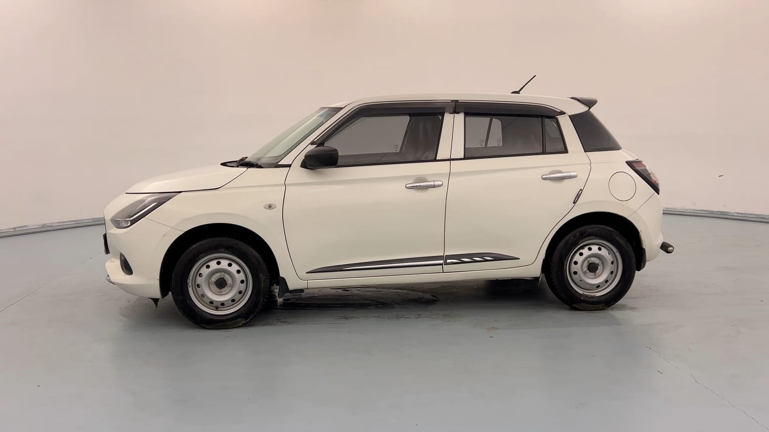 Used 2025 Maruti Suzuki Swift LXi Petrol Manual exterior LEFT SIDE VIEW