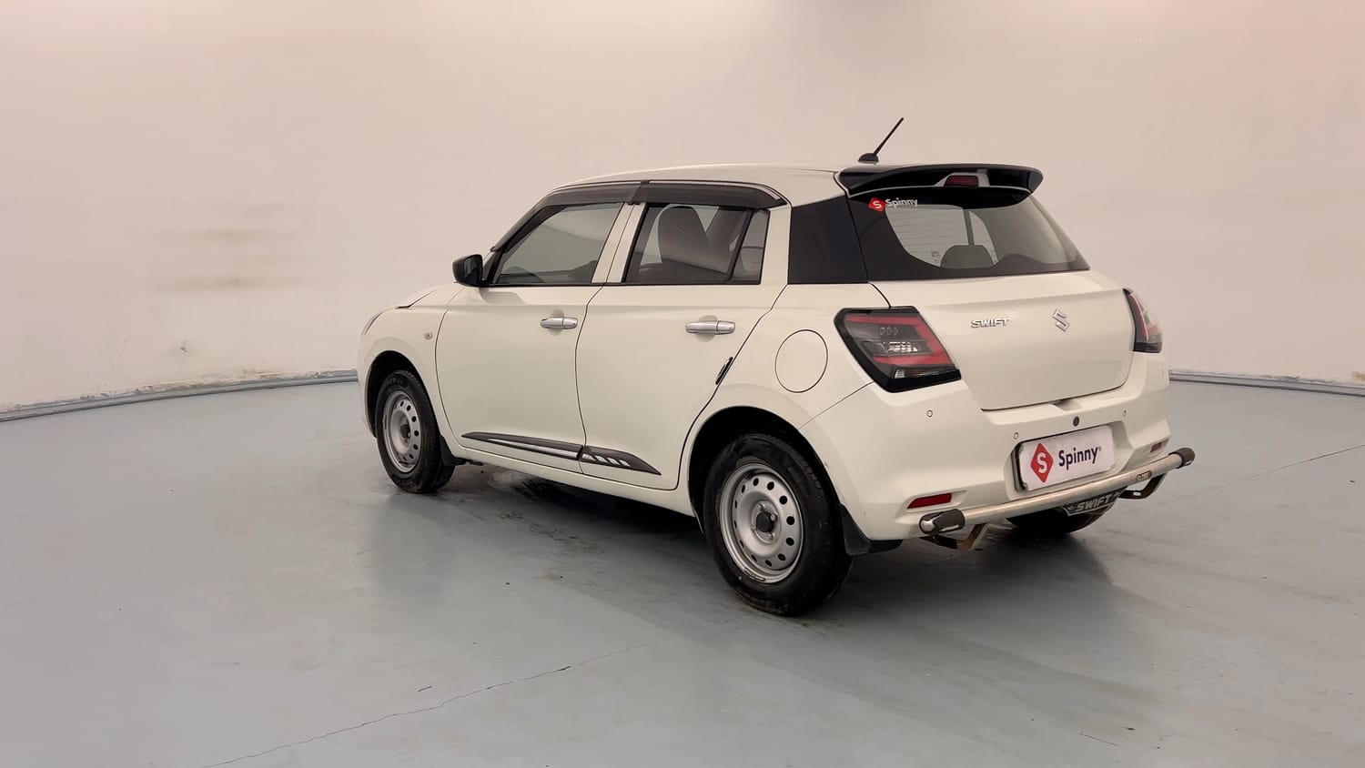 Used 2025 Maruti Suzuki Swift LXi Petrol Manual exterior LEFT REAR CORNER VIEW
