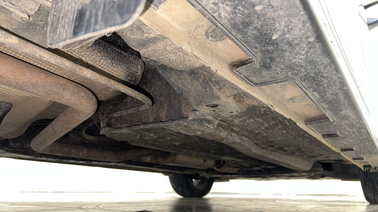 Used 2023 Hyundai New i20 Asta (O) 1.0 Turbo DCT Petrol Automatic extra REAR RIGHT UNDERBODY VIEW