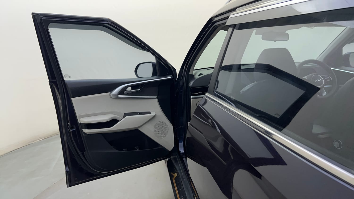 Used 2022 Kia Carens Prestige Plus 1.4 Petrol MT 7 STR Petrol Manual interior LEFT FRONT DOOR OPEN VIEW
