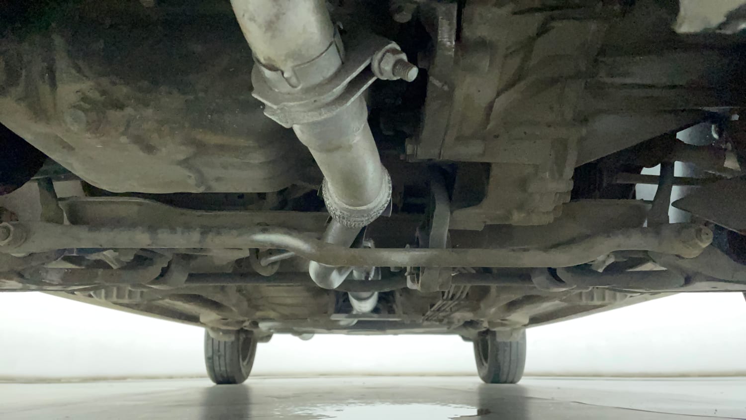Used 2016 Tata Tiago Revotron XT Petrol Manual extra FRONT LEFT UNDERBODY VIEW