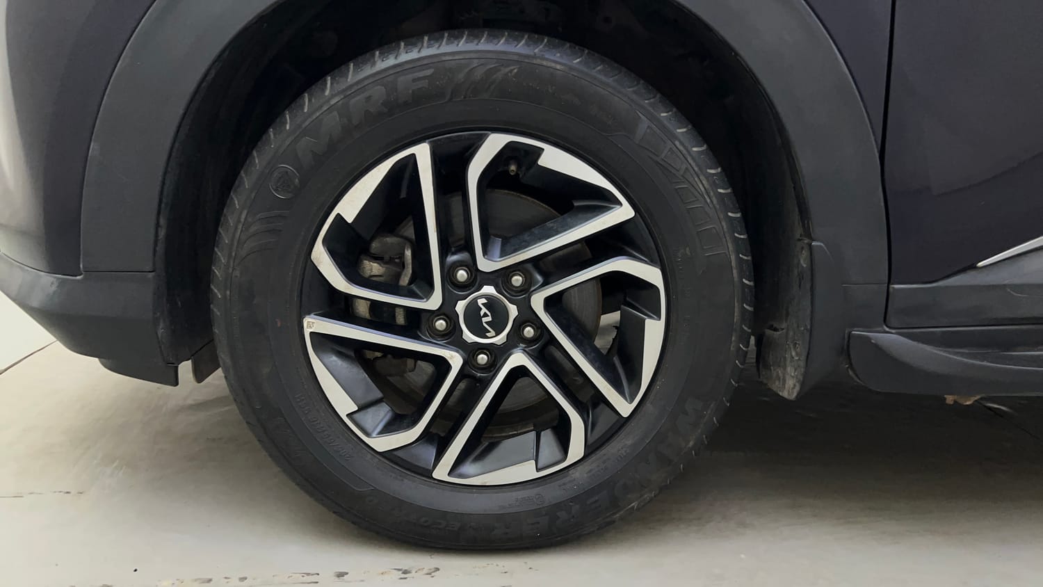 Used 2022 Kia Carens Prestige Plus 1.4 Petrol MT 7 STR Petrol Manual tyres LEFT FRONT TYRE RIM VIEW