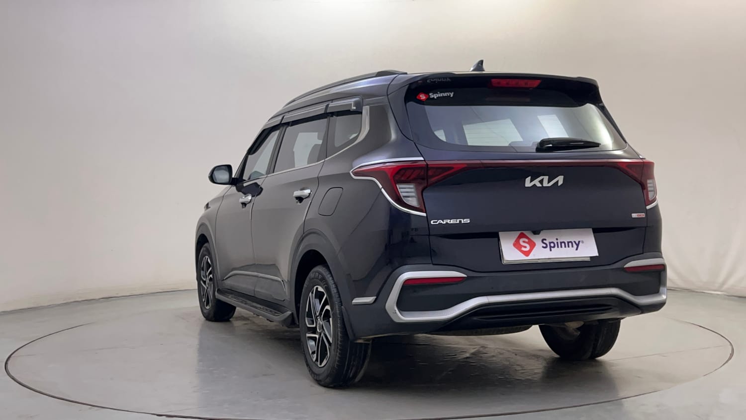 Used 2022 Kia Carens Prestige Plus 1.4 Petrol MT 7 STR Petrol Manual exterior LEFT REAR CORNER VIEW