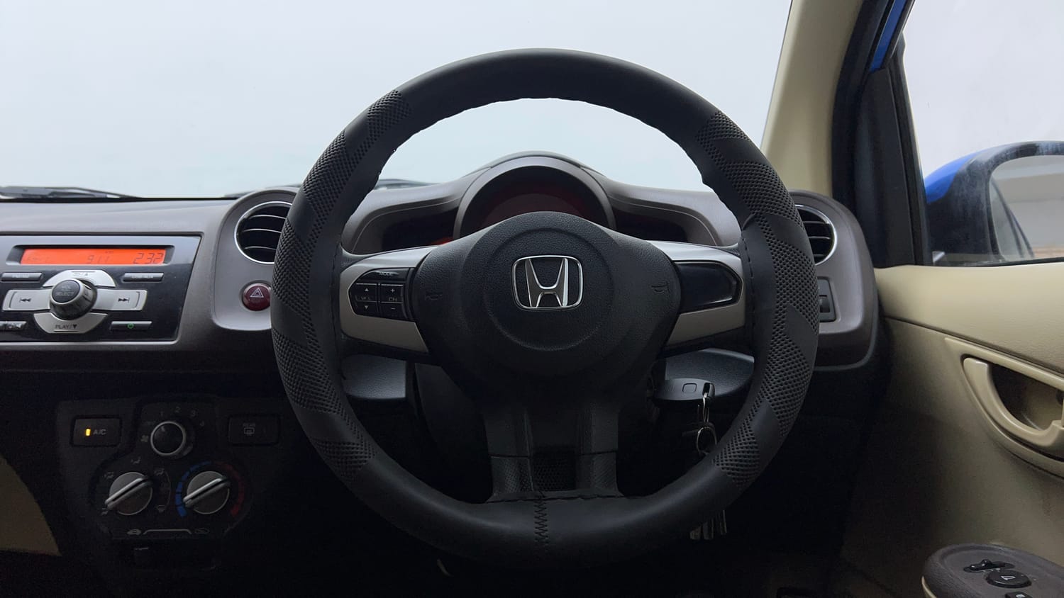 Used 2013 Honda Brio S MT Petrol Manual interior STEERING VIEW