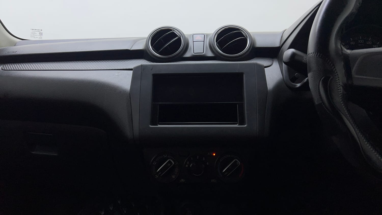 Used 2023 Maruti Suzuki Swift LXi Petrol Manual interior MUSIC SYSTEM & AC CONTROL VIEW