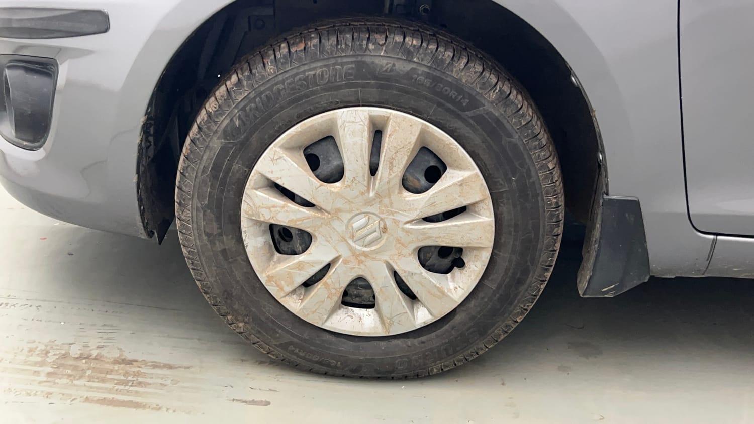 Used 2013 Maruti Suzuki Swift Dzire VXI Petrol Manual tyres LEFT FRONT TYRE RIM VIEW