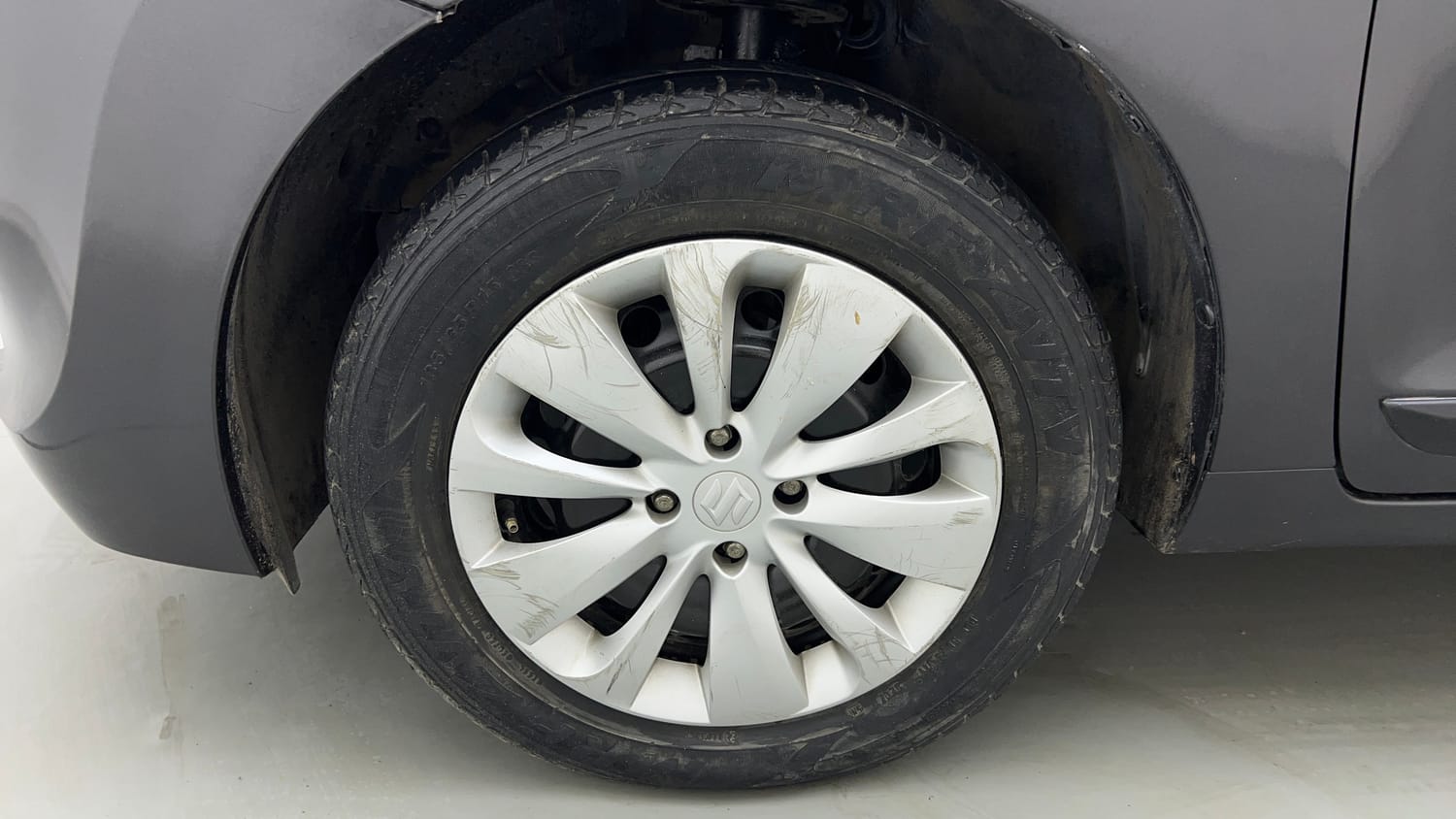 Used 2017 Maruti Suzuki Baleno Delta 1.2 Petrol Manual tyres LEFT FRONT TYRE RIM VIEW