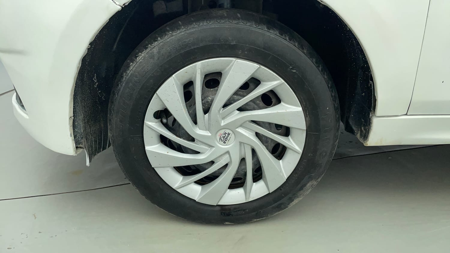 Used 2016 Tata Tiago Revotron XT Petrol Manual tyres LEFT FRONT TYRE RIM VIEW
