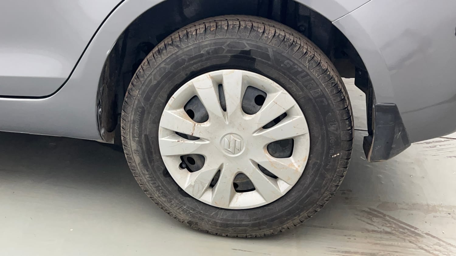 Used 2013 Maruti Suzuki Swift Dzire VXI Petrol Manual tyres LEFT REAR TYRE RIM VIEW