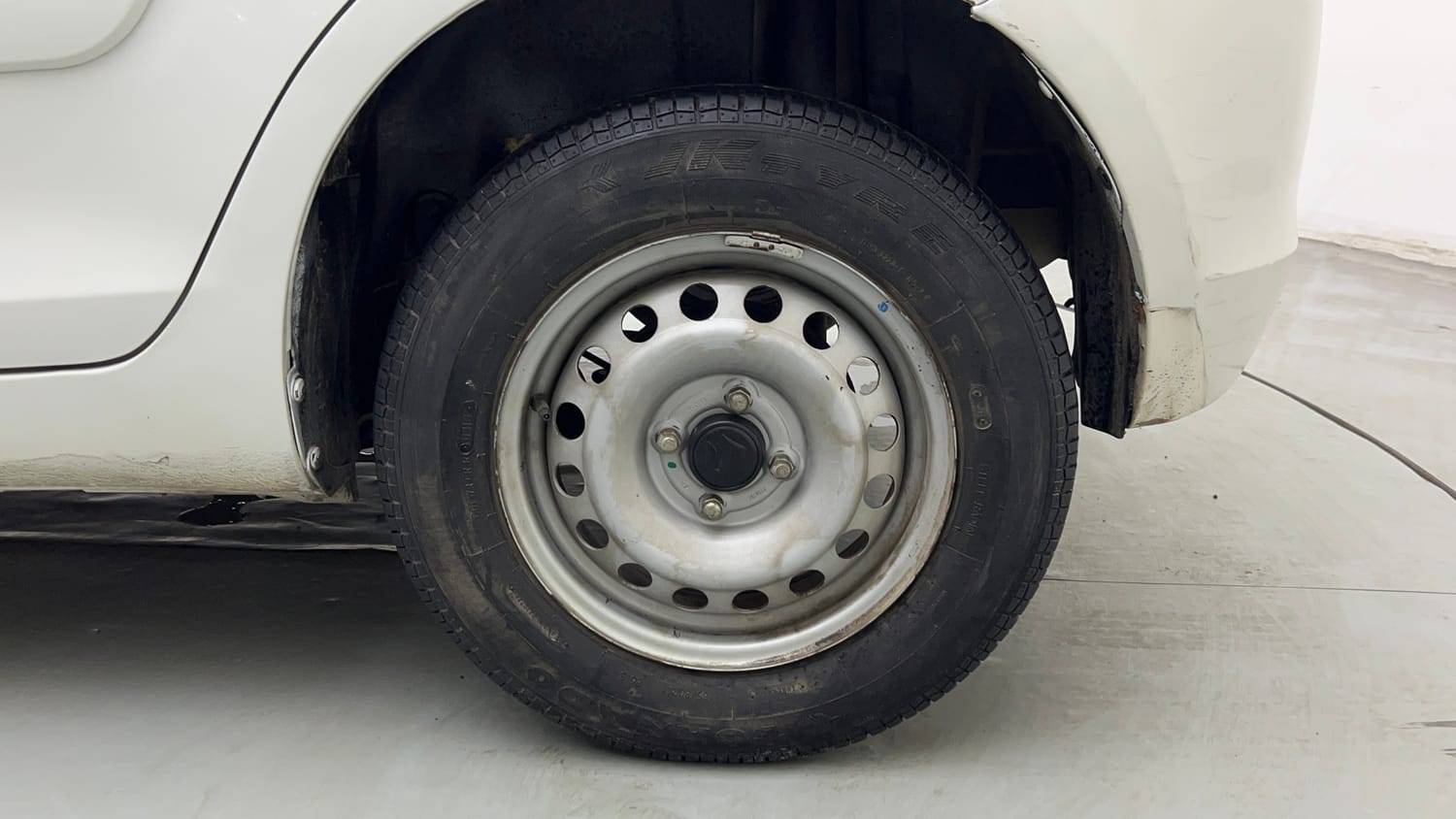 Used 2015 Maruti Suzuki Swift Lxi (O) Petrol Manual tyres LEFT REAR TYRE RIM VIEW