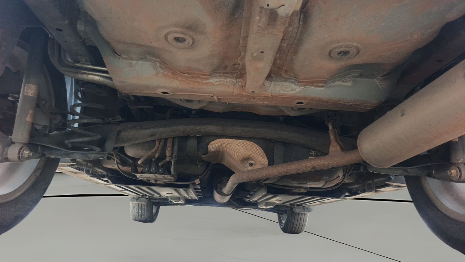 Used 2022 Maruti Suzuki Grand Vitara Alpha Smart Hybrid AT Petrol Automatic extra REAR UNDERBODY VIEW (TAKEN FROM REAR)