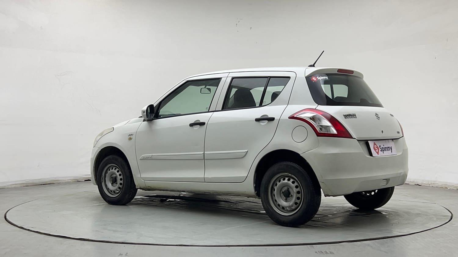 Used 2015 Maruti Suzuki Swift Lxi (O) Petrol Manual exterior LEFT REAR CORNER VIEW