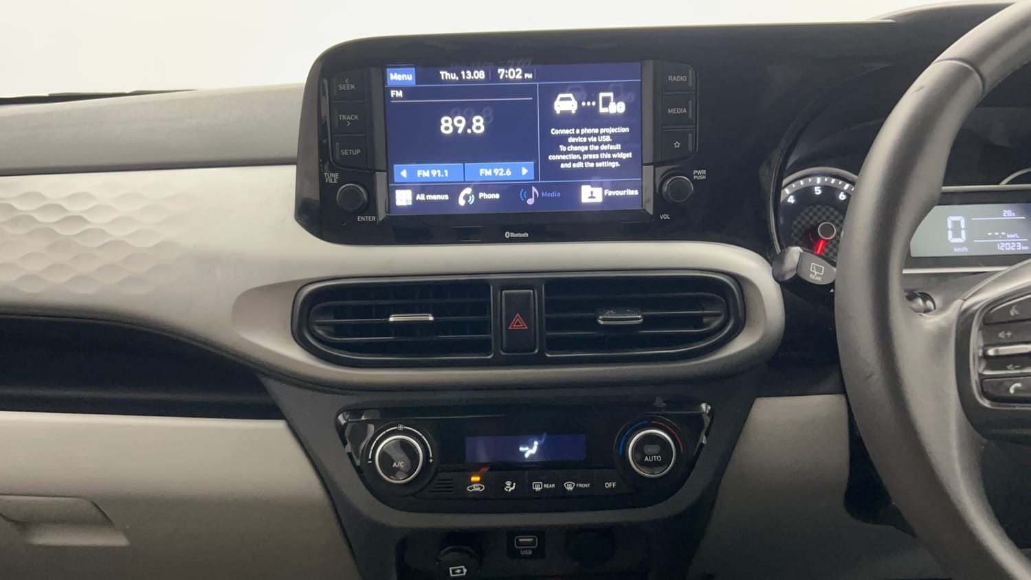 Used 2022 Hyundai Grand i10 Nios Asta 1.2 Kappa VTVT Petrol Manual interior MUSIC SYSTEM & AC CONTROL VIEW
