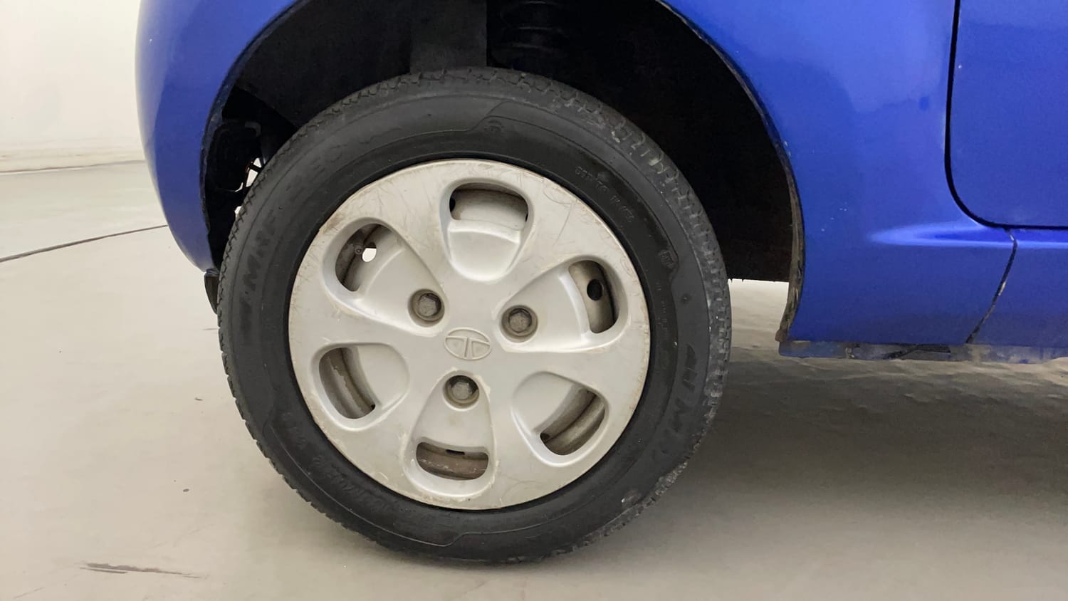 Used 2015 Tata Nano Twist XT Petrol Manual tyres LEFT FRONT TYRE RIM VIEW