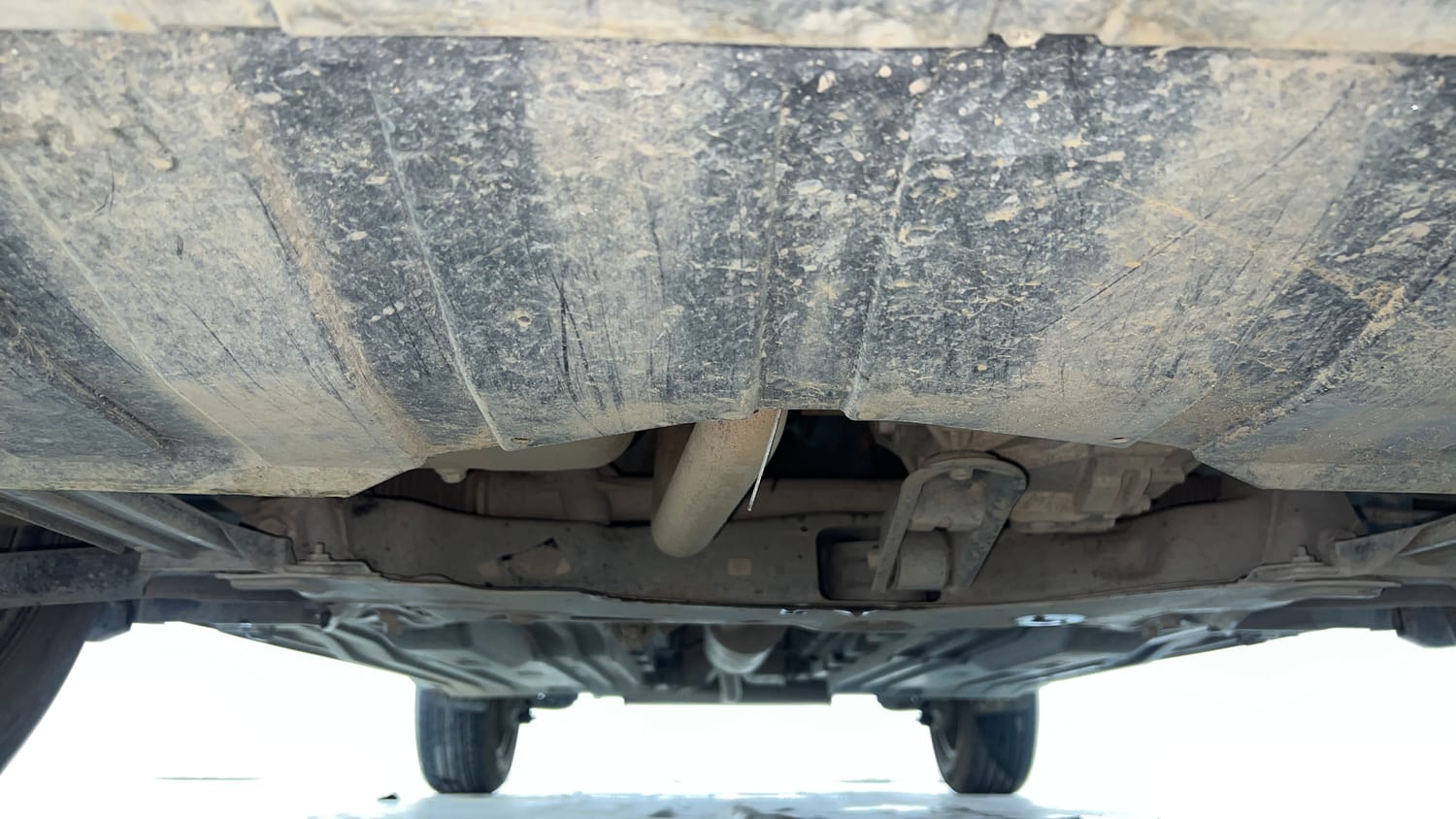 Used 2023 Maruti Suzuki Brezza VXi Petrol Manual extra FRONT LEFT UNDERBODY VIEW