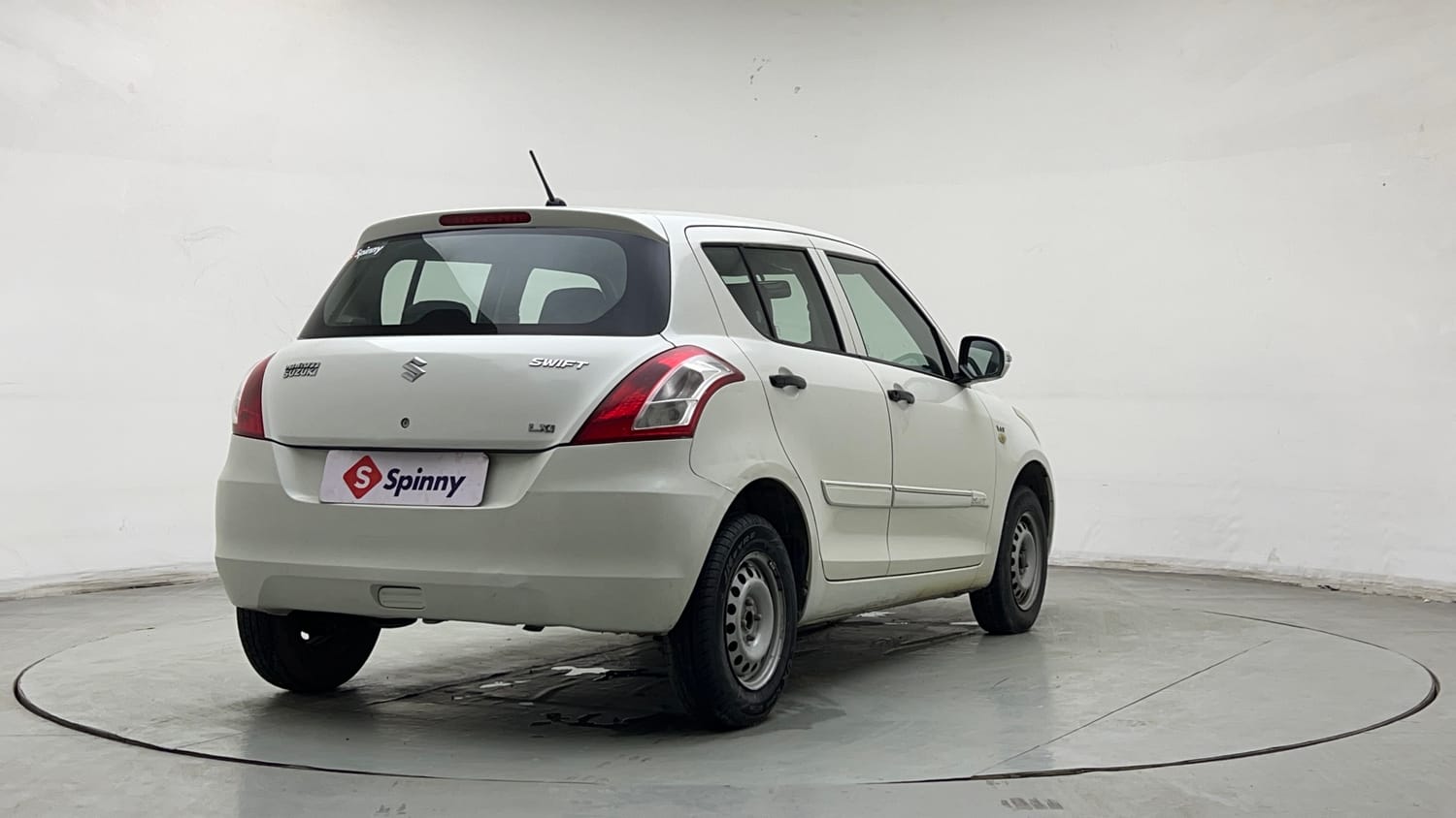 Used 2015 Maruti Suzuki Swift Lxi (O) Petrol Manual exterior RIGHT REAR CORNER VIEW