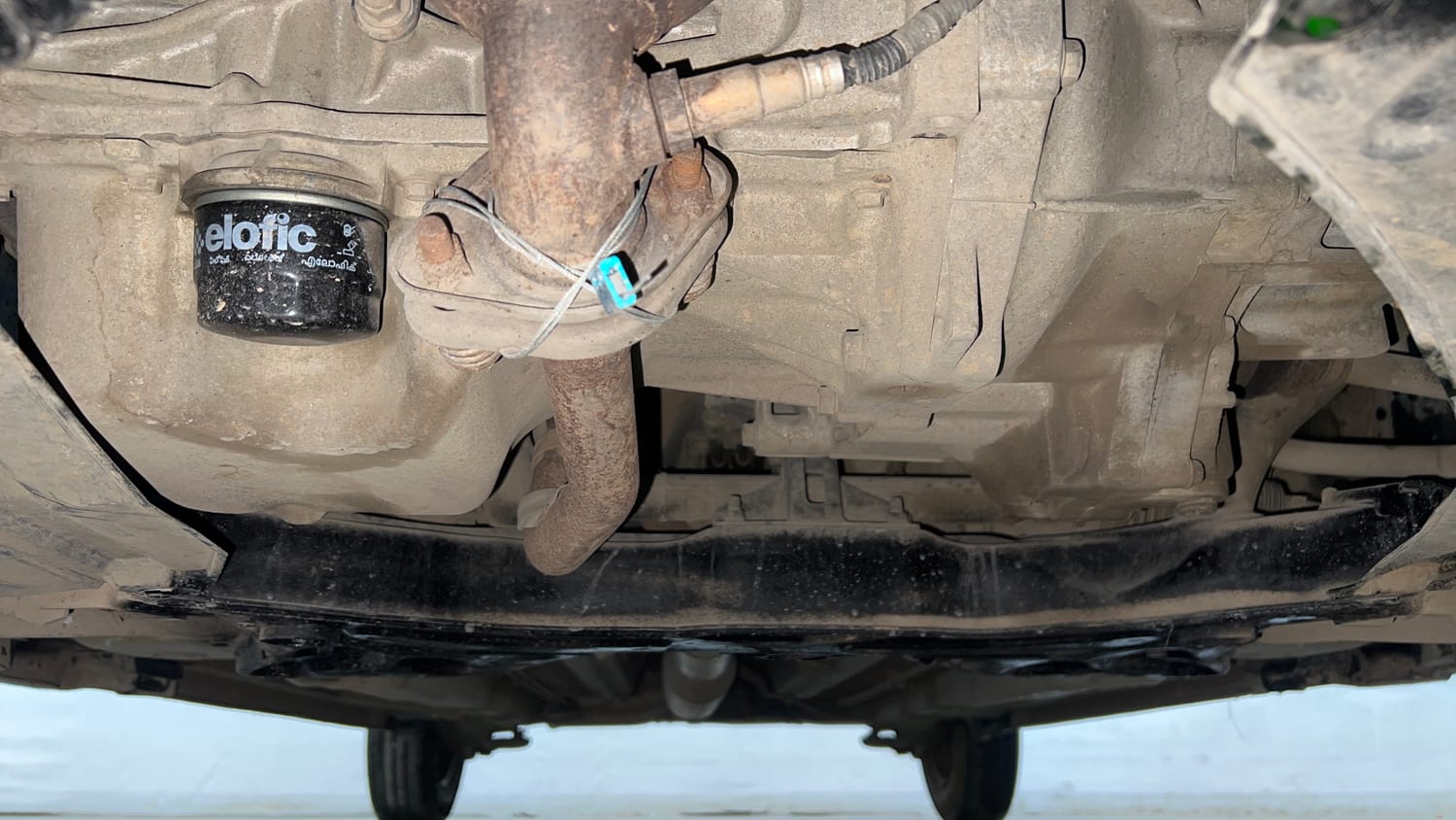 Used 2015 Maruti Suzuki Swift Lxi (O) Petrol Manual extra FRONT LEFT UNDERBODY VIEW