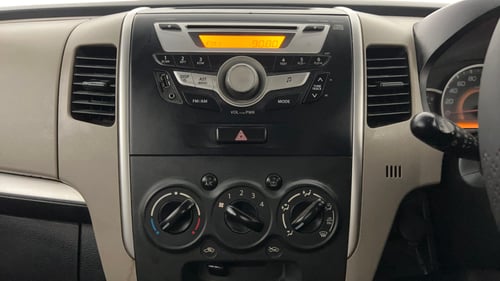 Used 2013 Maruti Suzuki Wagon R VXI Petrol Manual top_features Integrated (in-dash) music system