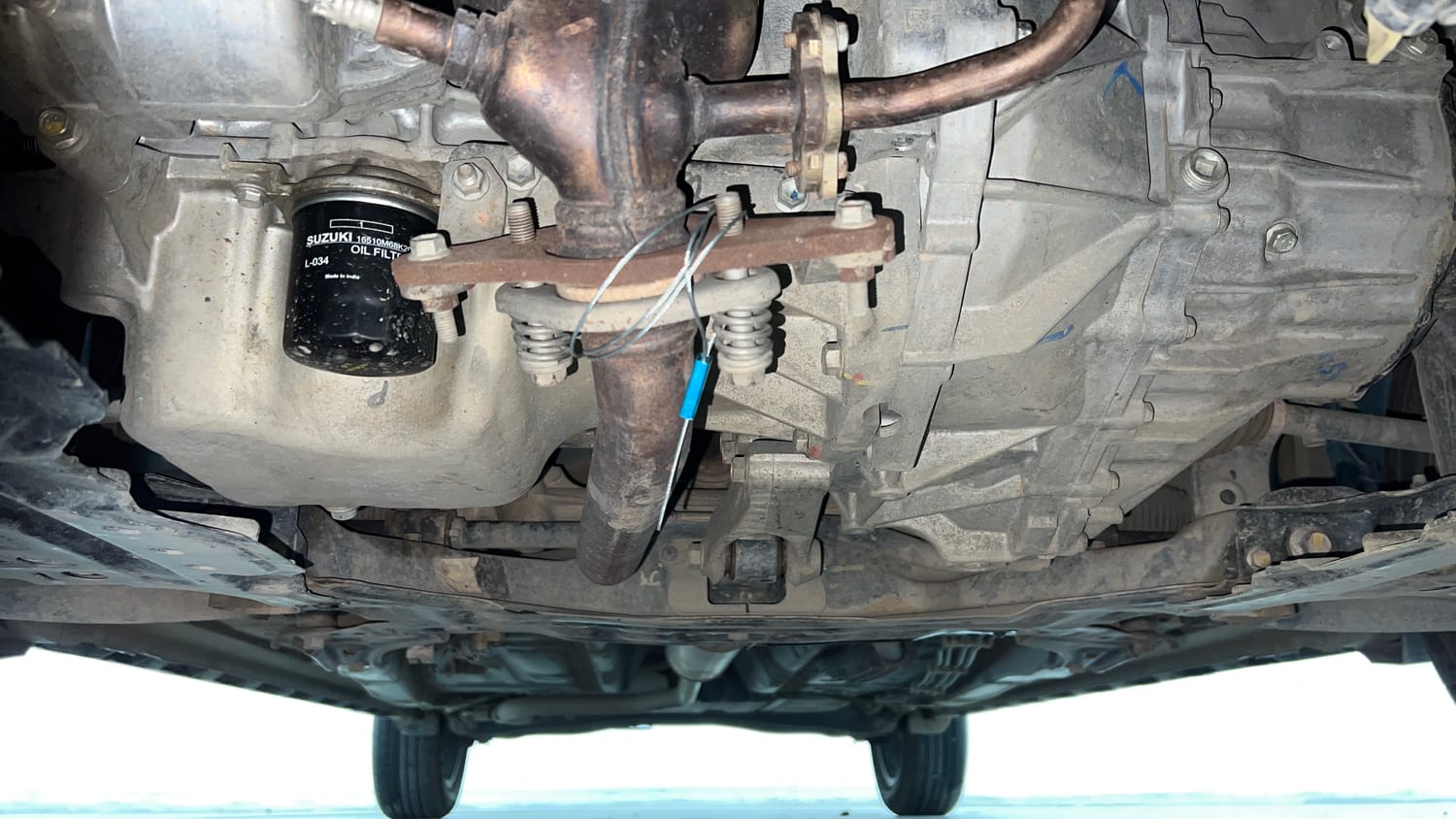 Used 2022 Maruti Suzuki XL6 Alpha Plus MT Petrol Petrol Manual extra FRONT LEFT UNDERBODY VIEW