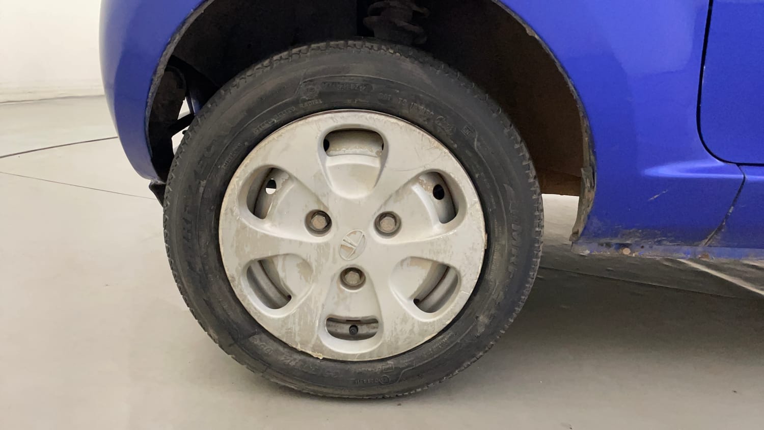 Used 2014 Tata Nano LX Petrol Manual tyres LEFT FRONT TYRE RIM VIEW