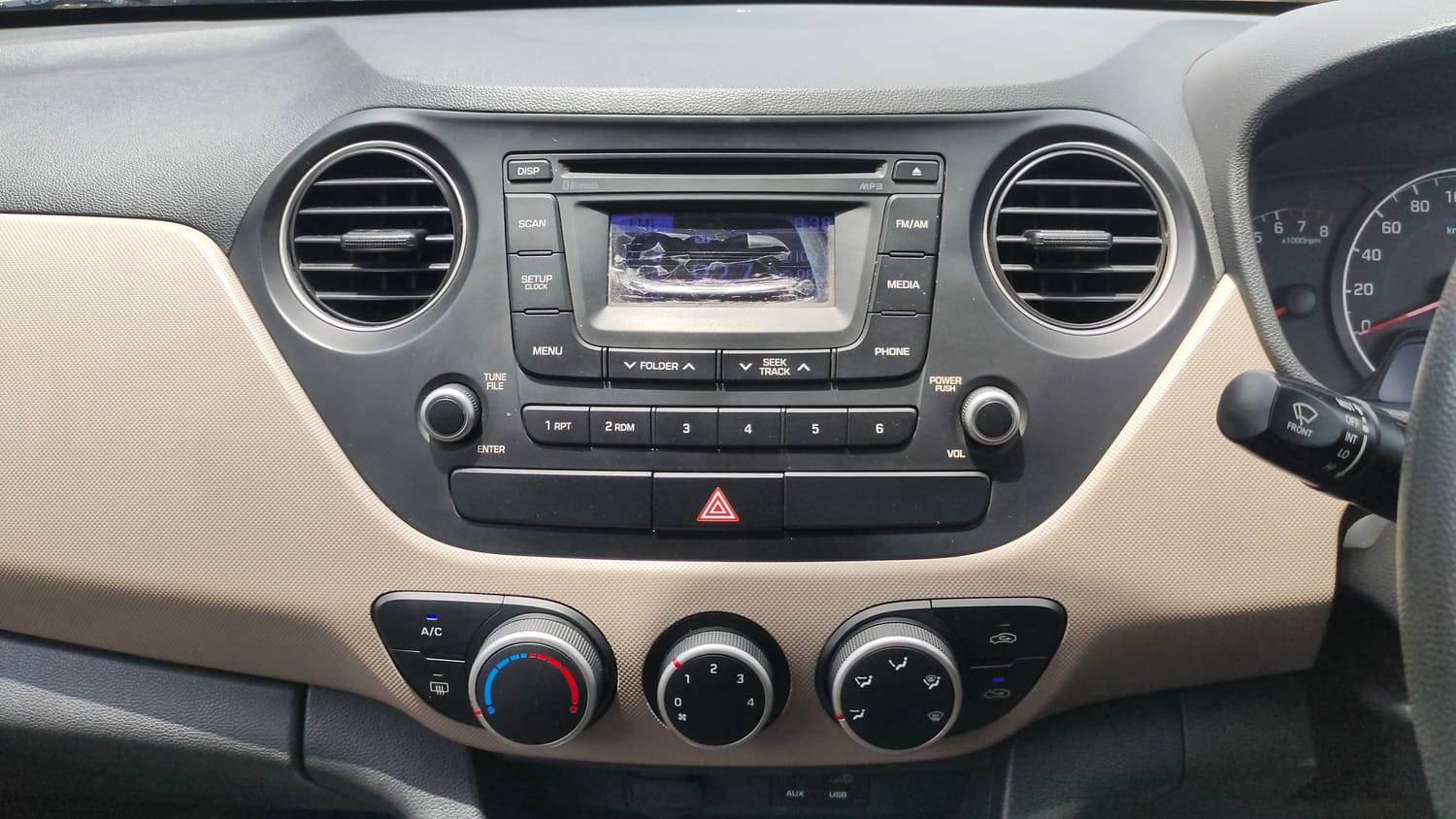 Used 2016 Hyundai Grand i10 Sportz 1.2 Kappa VTVT Petrol Manual interior MUSIC SYSTEM & AC CONTROL VIEW