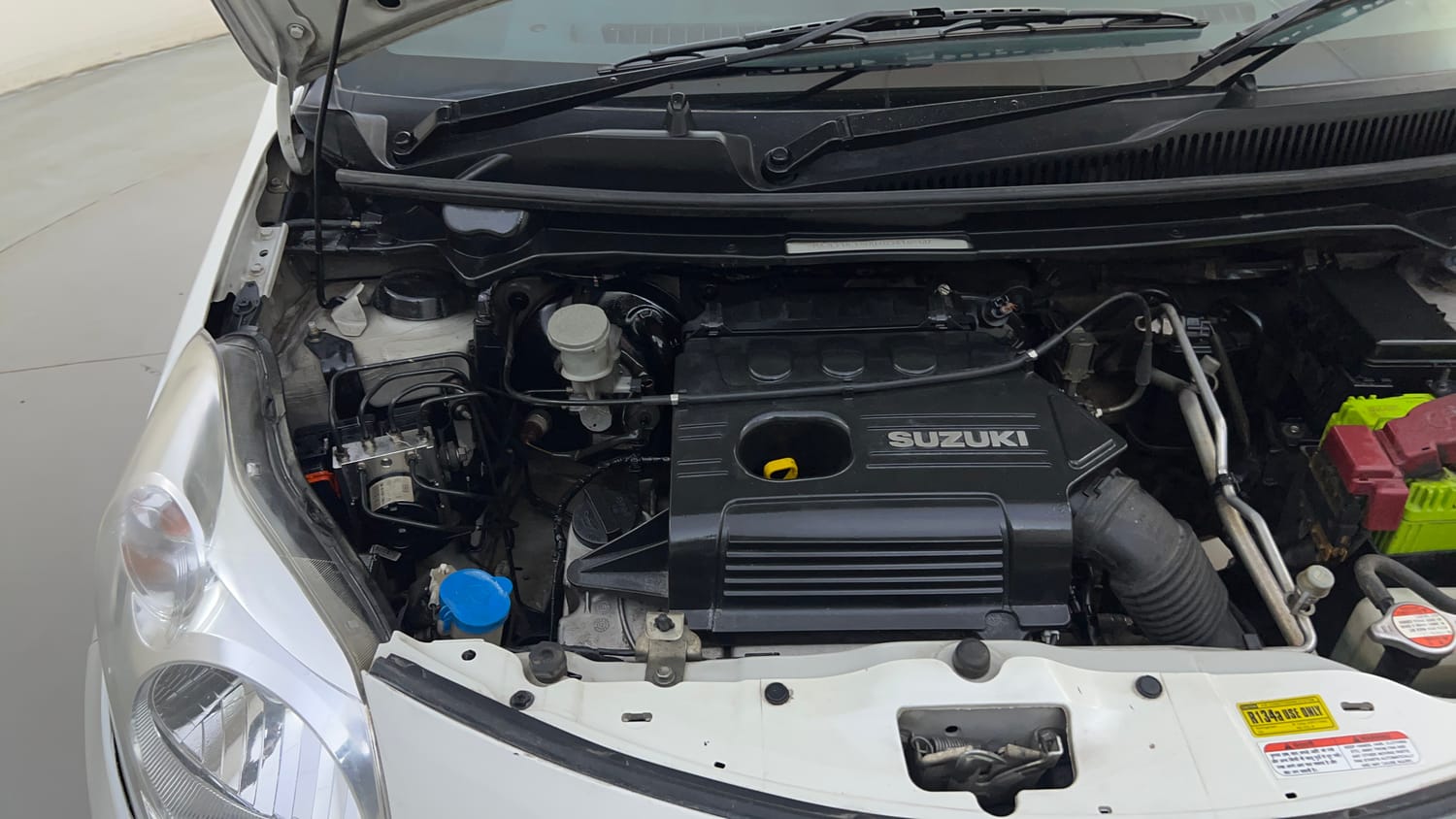 Used 2013 Maruti Suzuki A-Star Vxi (ABS) AT Petrol Automatic engine ENGINE RIGHT SIDE HINGE & APRON VIEW