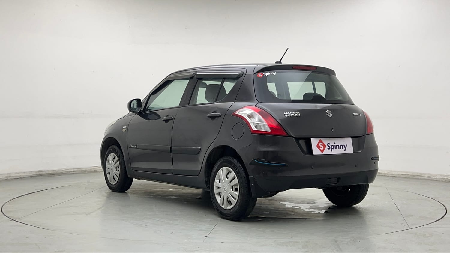 Used 2017 Maruti Suzuki Swift Lxi (O) Petrol Manual exterior LEFT REAR CORNER VIEW