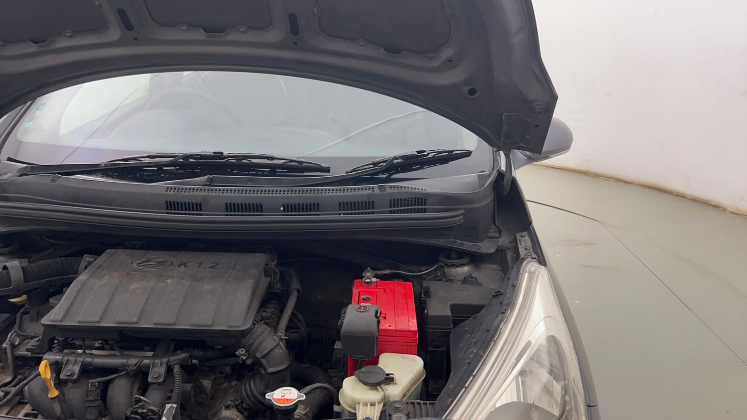 Used 2015 Hyundai Grand i10 Sportz 1.2 Kappa VTVT Petrol Manual engine ENGINE LEFT SIDE HINGE & APRON VIEW