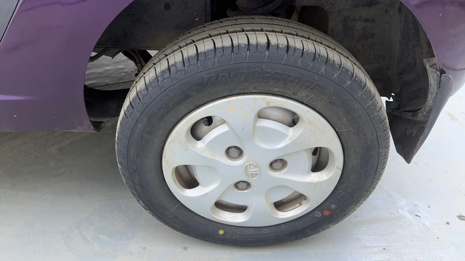 Used 2016 Tata Nano GenX XT Petrol Manual tyres LEFT REAR TYRE RIM VIEW