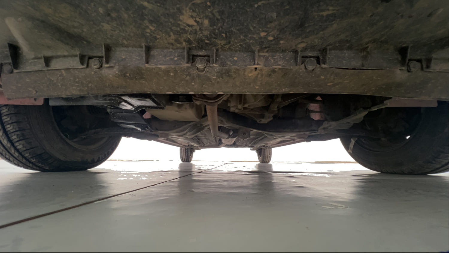 Used 2015 Maruti Suzuki Celerio VXi AMT Petrol Automatic extra FRONT LEFT UNDERBODY VIEW