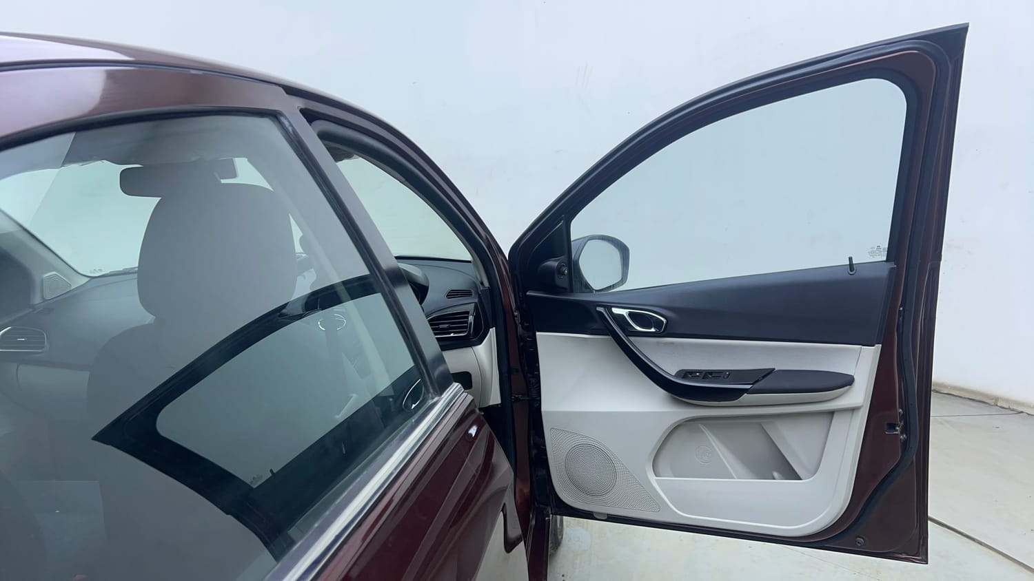 Used 2022 Tata Tigor XZA Plus Dual Tone Petrol Automatic interior RIGHT FRONT DOOR OPEN VIEW