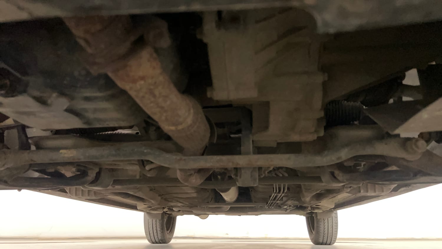 Used 2016 Tata Tiago Revotron XT Petrol Manual extra FRONT LEFT UNDERBODY VIEW