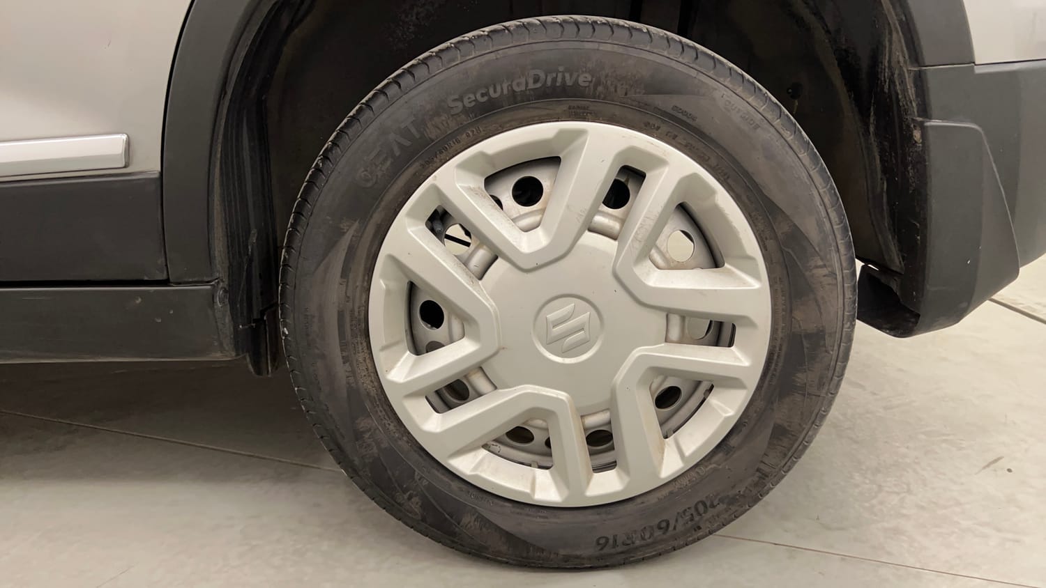 Used 2022 maruti-suzuki Vitara Brezza LXi Petrol Manual tyres LEFT REAR TYRE RIM VIEW