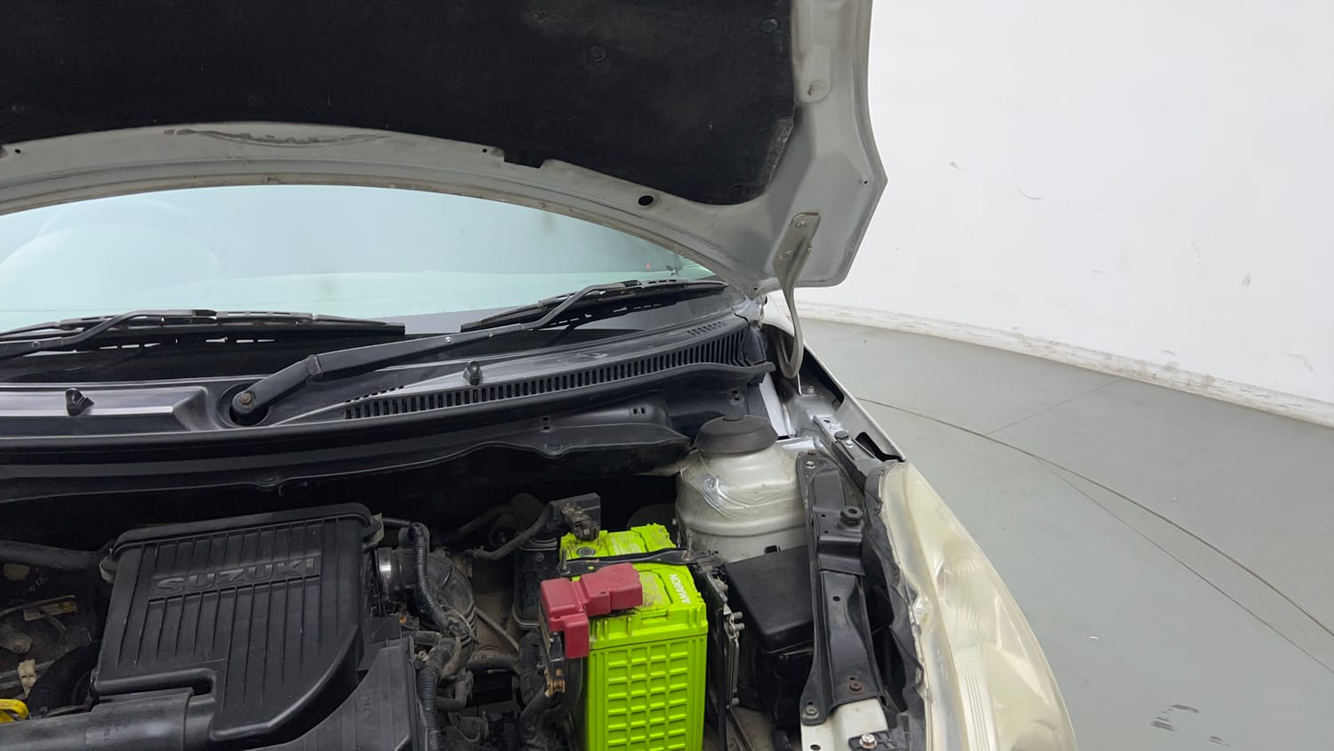Used 2017 Maruti Suzuki Swift LXi (O) Petrol Manual engine ENGINE LEFT SIDE HINGE & APRON VIEW