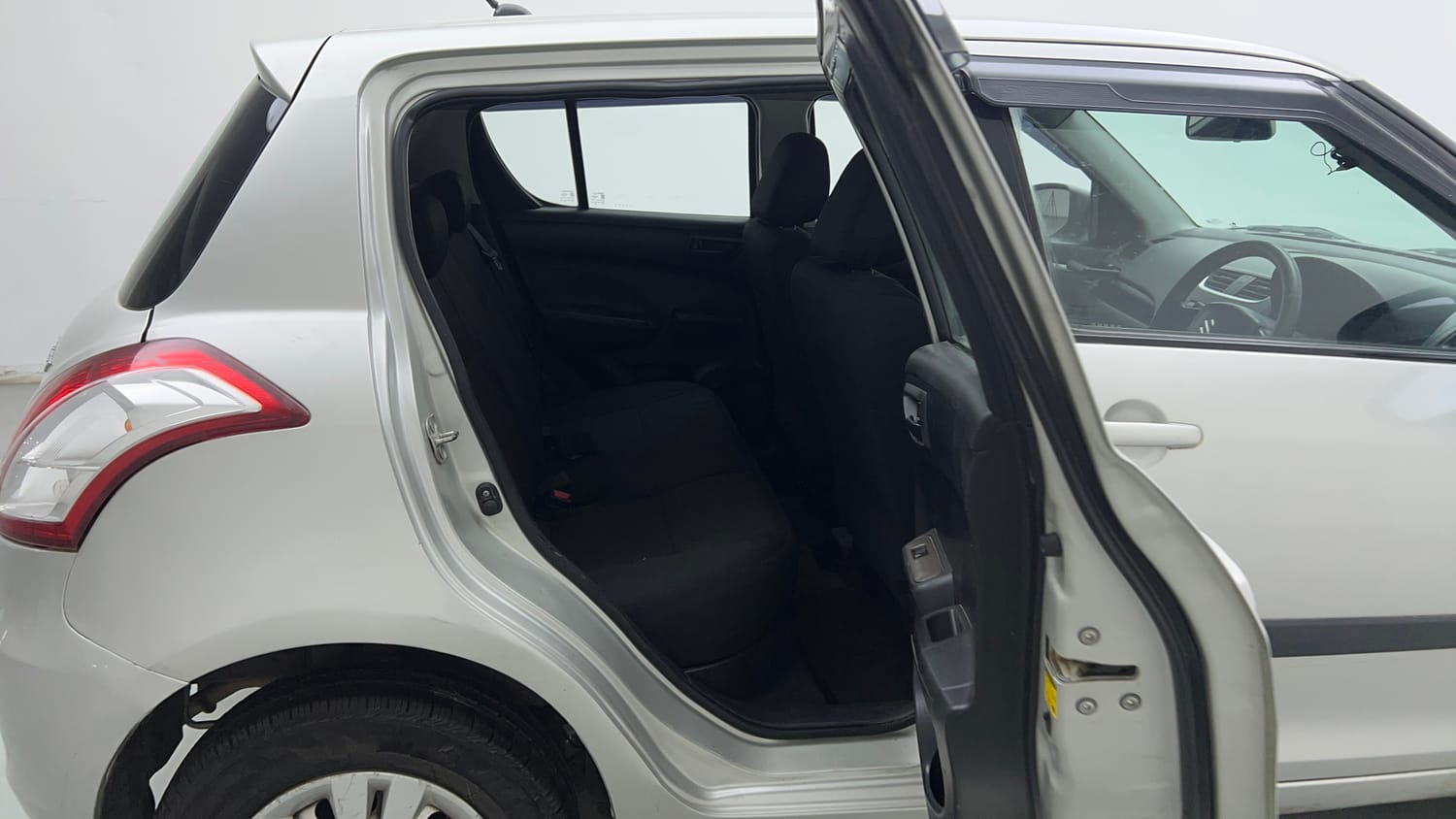 Used 2017 Maruti Suzuki Swift LXi (O) Petrol Manual interior RIGHT SIDE REAR DOOR CABIN VIEW