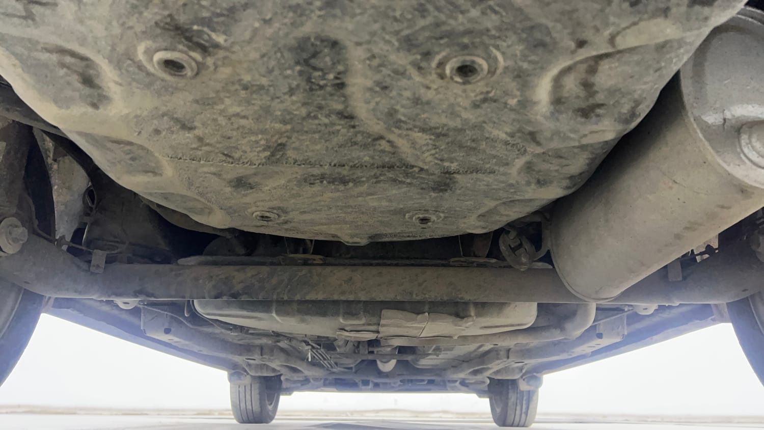 Used 2022 Tata Tigor XZA Plus Dual Tone Petrol Automatic extra REAR UNDERBODY VIEW (TAKEN FROM REAR)