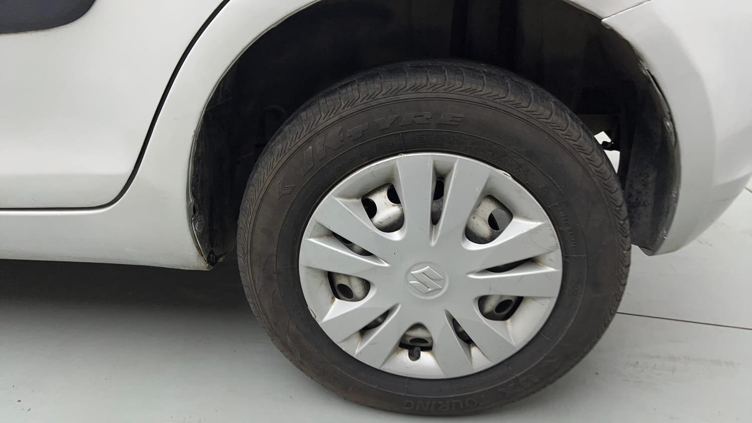 Used 2017 Maruti Suzuki Swift LXi (O) Petrol Manual tyres LEFT REAR TYRE RIM VIEW