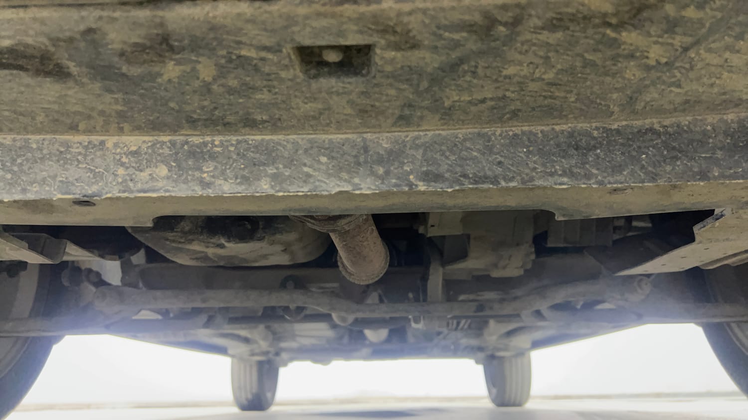 Used 2022 Tata Tigor XZA Plus Dual Tone Petrol Automatic extra FRONT LEFT UNDERBODY VIEW