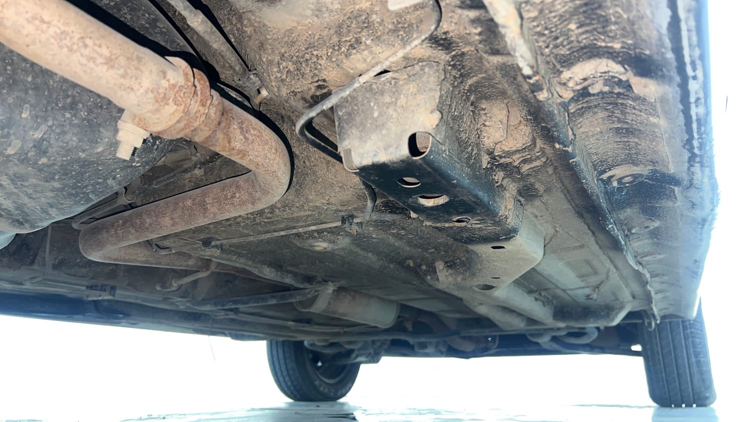 Used 2018 Tata Tiago XZ W/O Alloy Petrol + CNG(Outside Fitted) Cng Manual extra REAR RIGHT UNDERBODY VIEW
