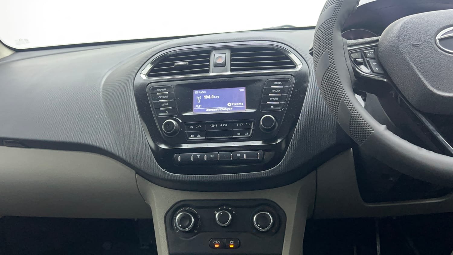 Used 2018 Tata Tiago XZ W/O Alloy Petrol + CNG(Outside Fitted) Cng Manual top_features Integrated (in-dash) music system