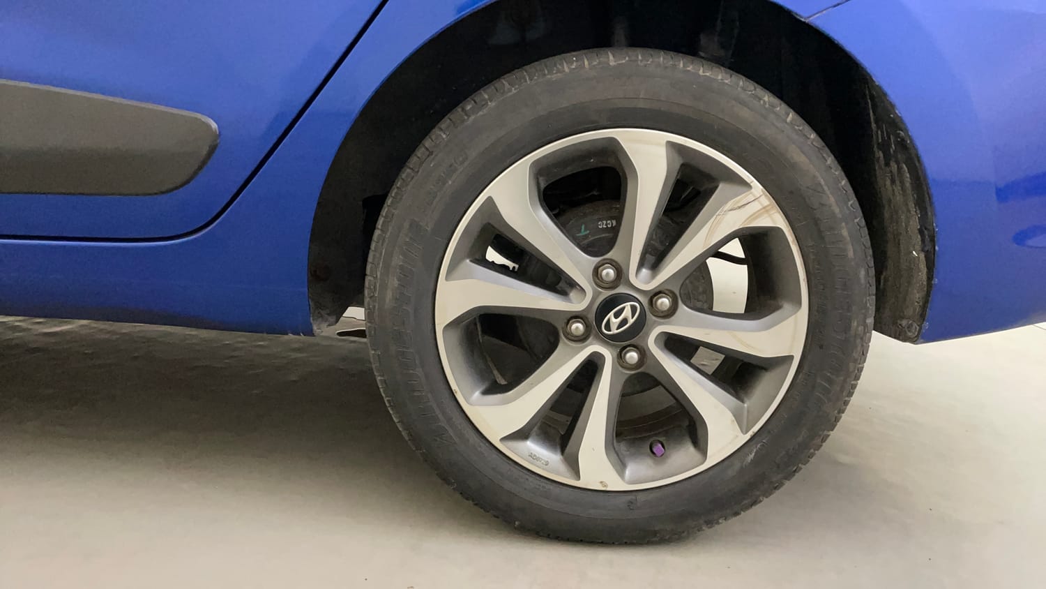 Used 2015 Hyundai Xcent SX 1.2 (O) Petrol Manual tyres LEFT REAR TYRE RIM VIEW