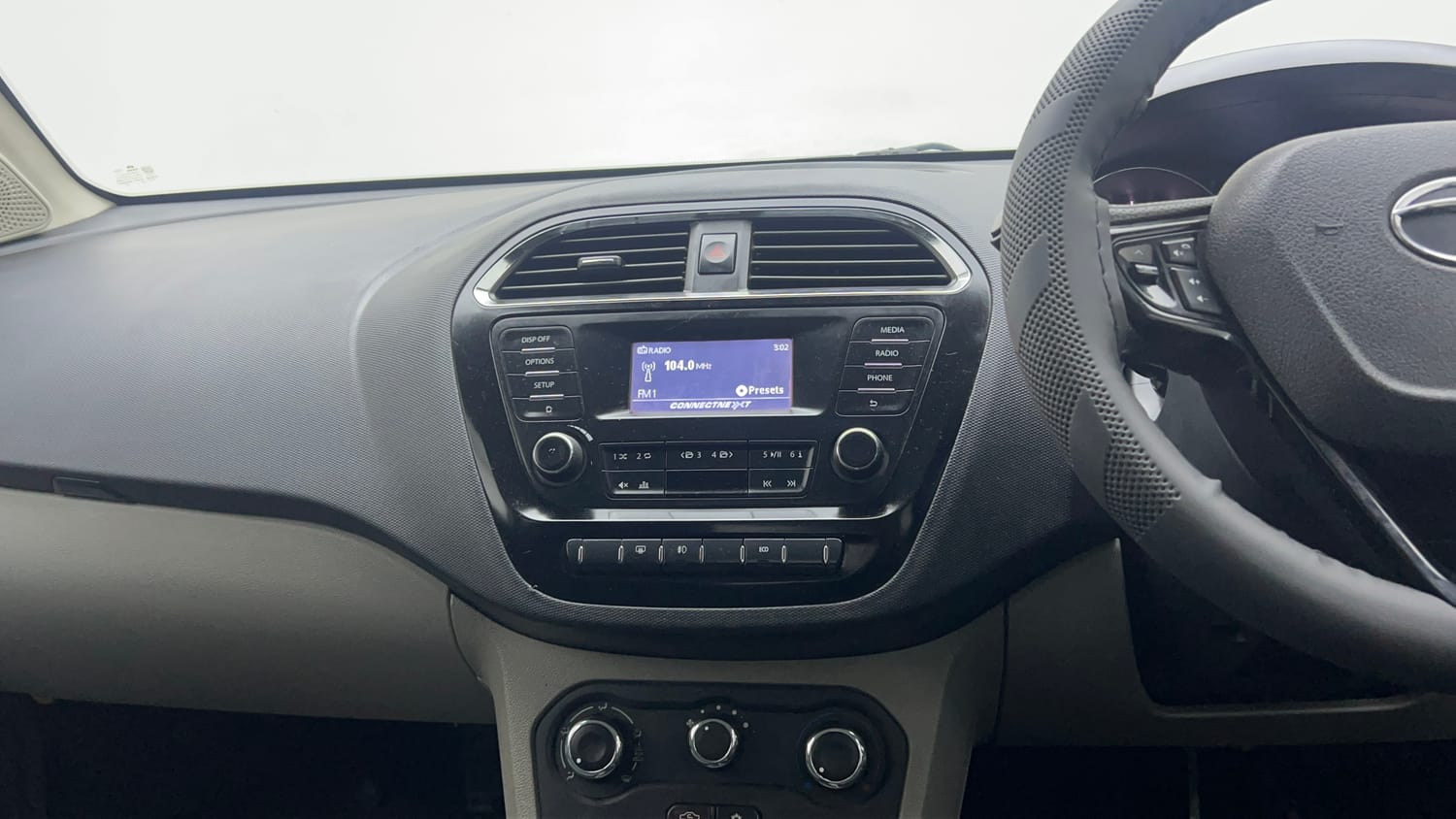 Used 2018 Tata Tiago XZ W/O Alloy Petrol + CNG(Outside Fitted) Cng Manual interior MUSIC SYSTEM & AC CONTROL VIEW