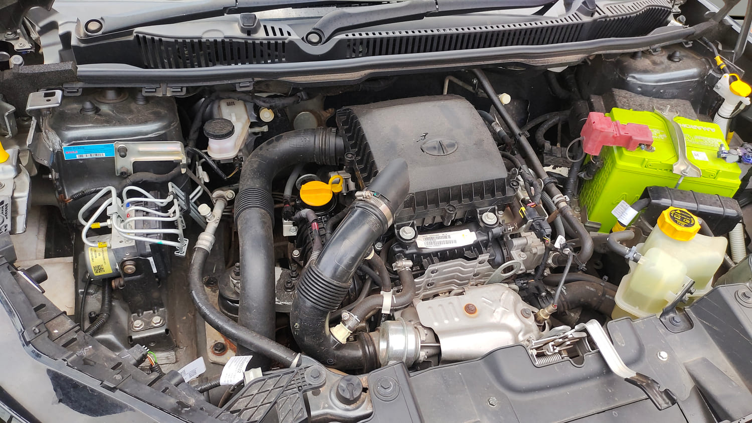 Used 2023 Tata Nexon Creative Plus S 1.2 Revotron Petrol 7DCA Petrol Automatic engine ENGINE RIGHT SIDE VIEW