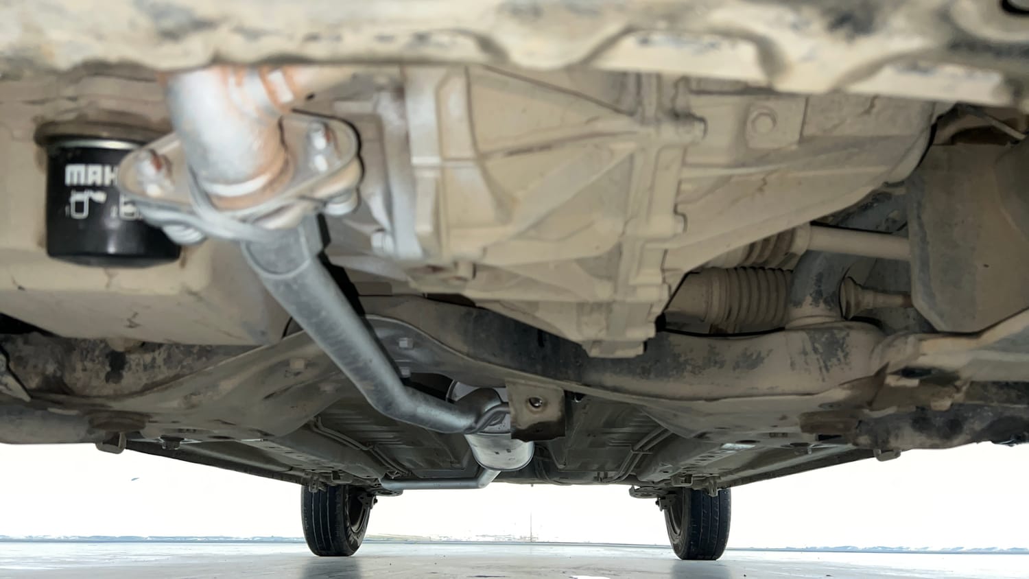 Used 2014 Maruti Suzuki Celerio VXi AMT Petrol Automatic extra FRONT LEFT UNDERBODY VIEW